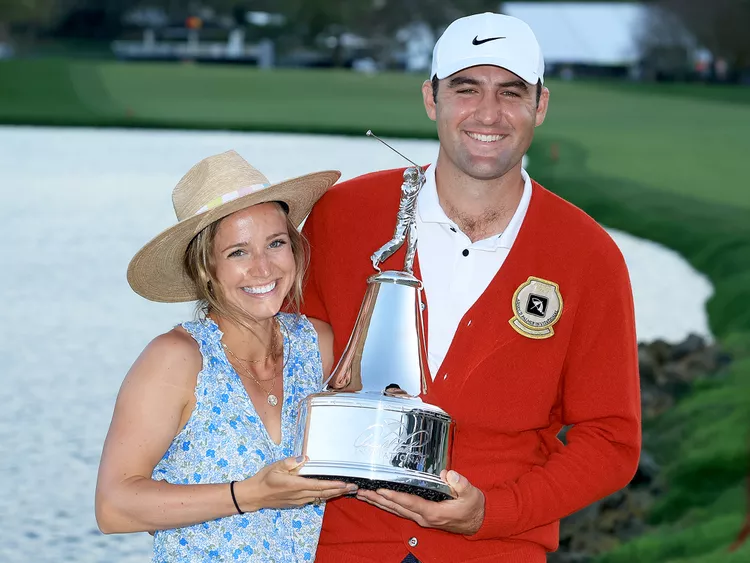 Scottie Scheffler with his wife Meredith Scheffler after his one stroke win in the final round of the Arnold Palmer Invitational